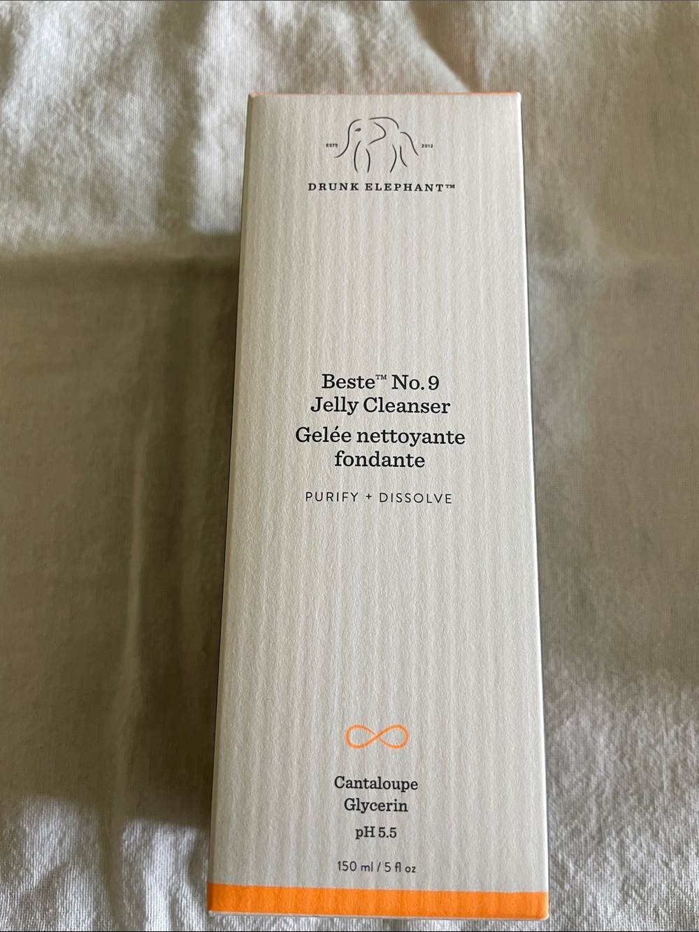 Drunk Elephant Beste No.9 Jelly Cleanser — White & Orange Accents